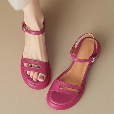 Pink sandals on a beige background