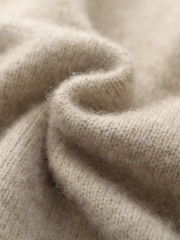 Close-up of beige knitted fabric texture