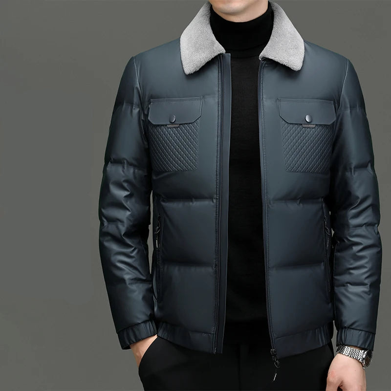 Dark blue puffer jacket with gray collar on a gray background