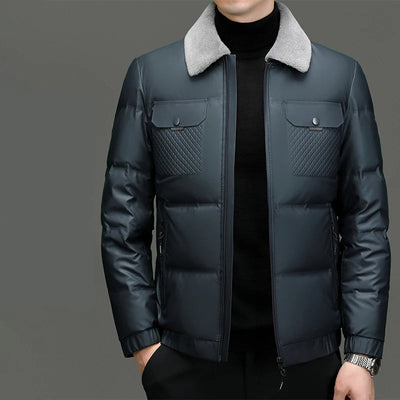 Dark blue puffer jacket with gray collar on a gray background