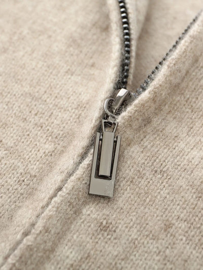 Close-up of a zipper on a beige fabric background