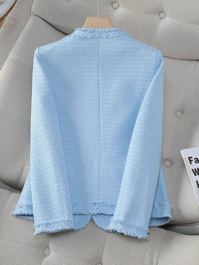 Light blue textured shirt on a gray sofa
