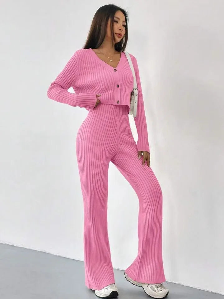 Woman wearing a pink ribbed outfit against a white background