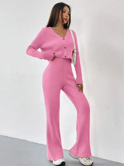 Woman wearing a pink ribbed outfit against a white background