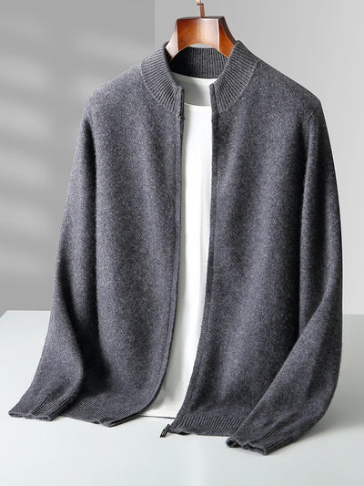 Gray sweater on a hanger against a gray background