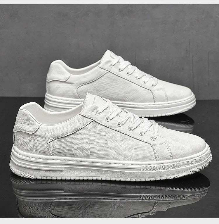 White sneakers on a reflective black surface with a gray background