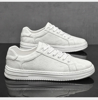 White sneakers on a reflective black surface with a gray background