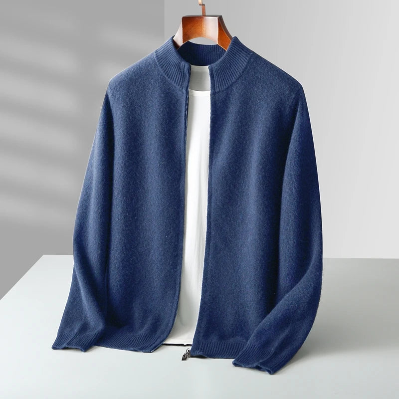 Blue sweater on a wooden hanger against a gray background