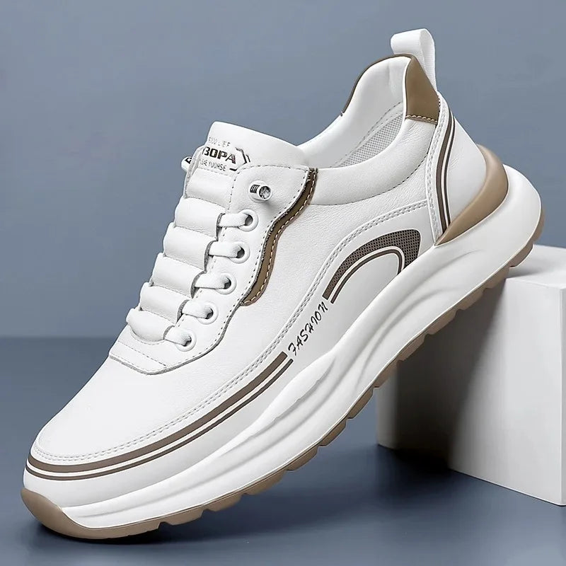 White sneaker with brown accents on a gray background