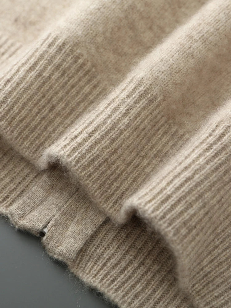 Close-up of a textured beige fabric with a subtle pattern.