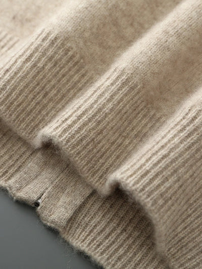 Close-up of a textured beige fabric with a subtle pattern.