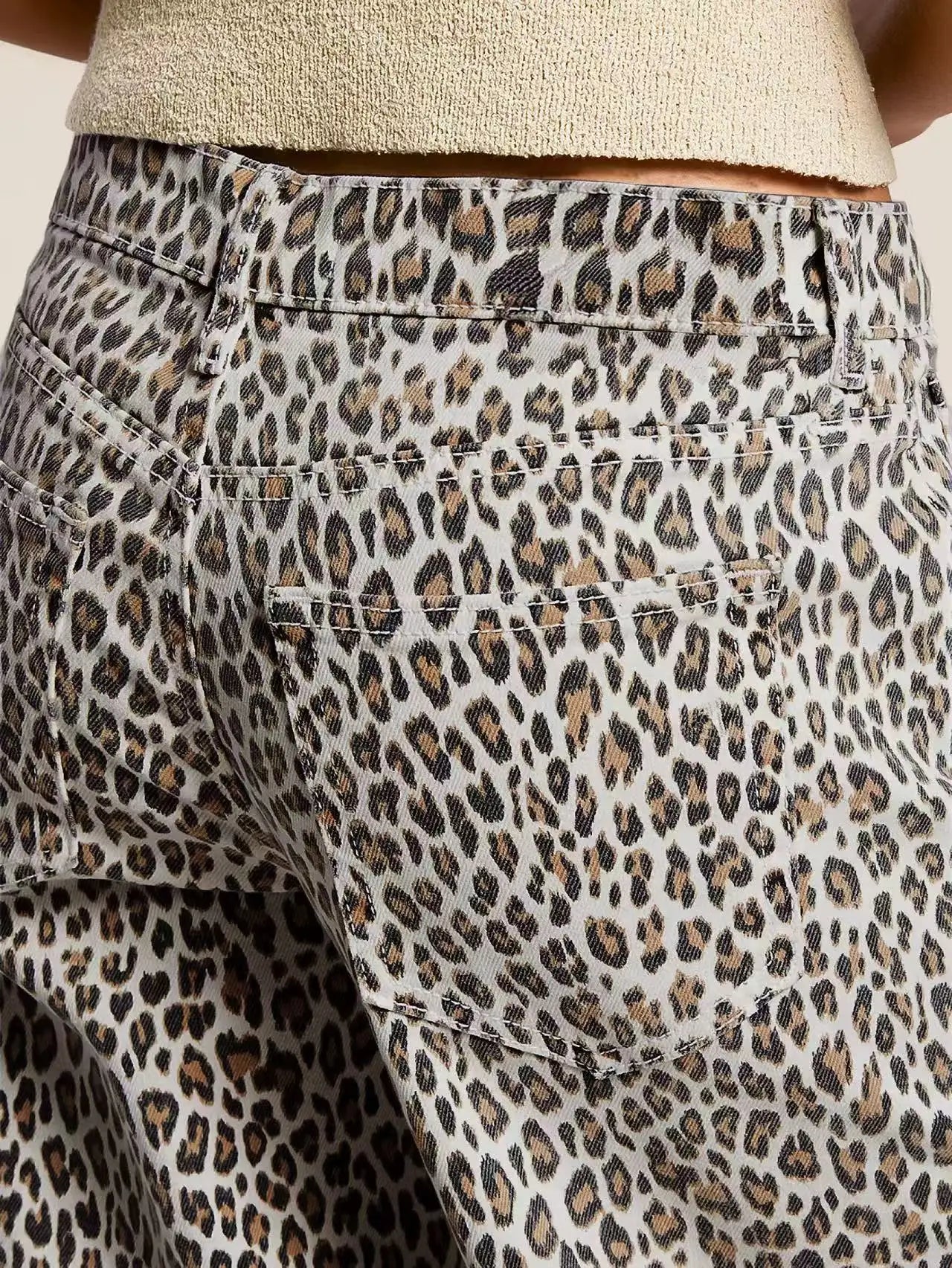 Leopard print pants with a beige top