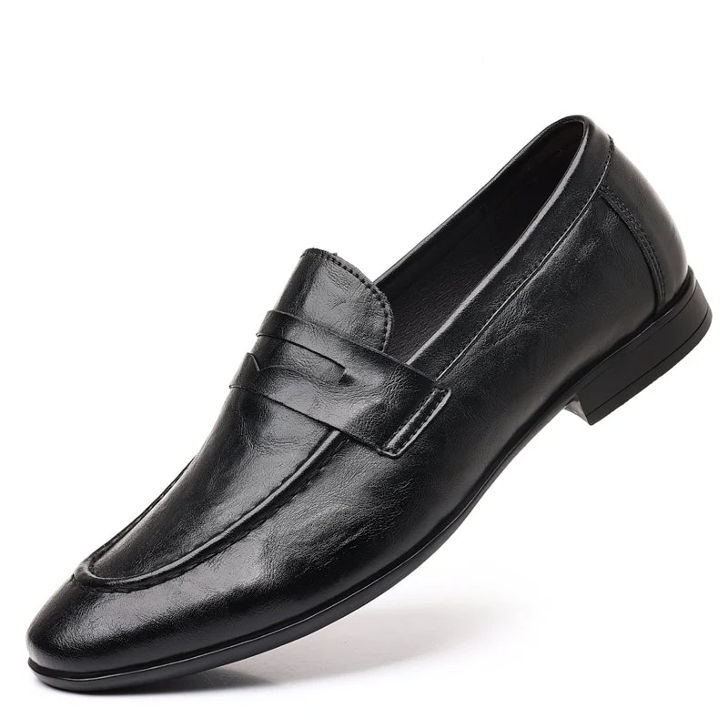 Black leather dress shoe on a white background