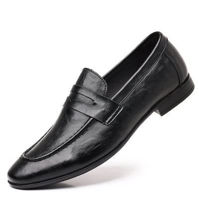Black leather dress shoe on a white background
