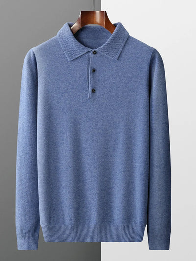 Blue sweater on a mannequin against a gray background