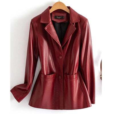 Red leather jacket on a hanger against a white background