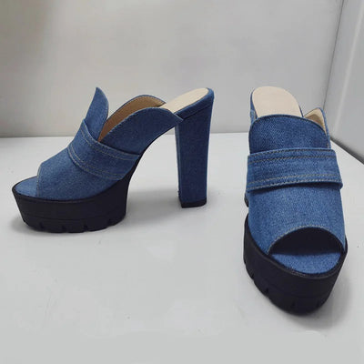 Blue denim 8.5 cm high-heeled shoes for women on a white surface with a gray background.