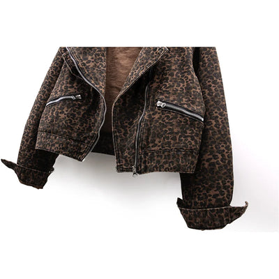 Close-up of front panel showing leopard print pattern and zipper detail.