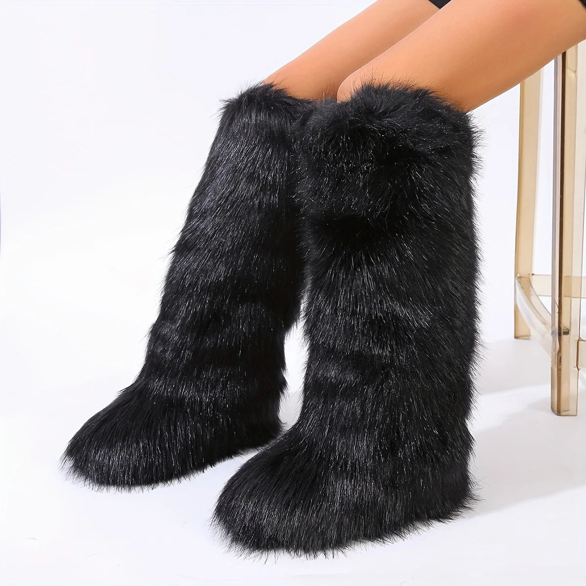 Black furry knee-high boots on a white background